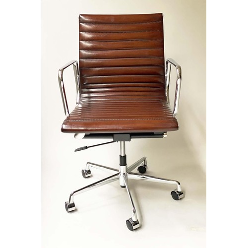 125 - REVOLVING DESK CHAIR, Charles and Ray Eames inspired with ribbed hand finished mid brown natural lea... 