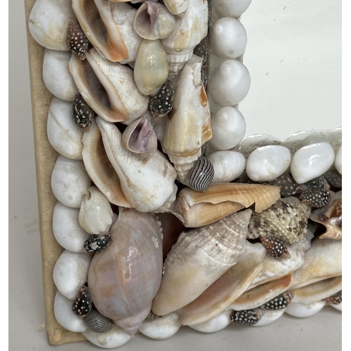 118 - SHELL WALL MIRROR, rectangular natural shell encrusted frame, 43cm x 33cm.