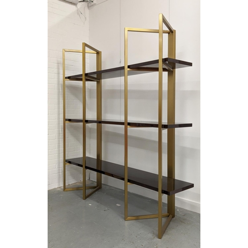 300 - BOOKCASE, two gilt metal supports holding three veneered shelves, 200cm x 50cm x 208.5cm approx.