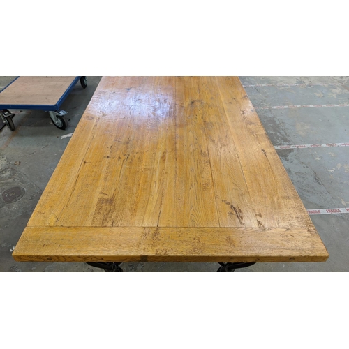 453 - REFECTORY TABLE, light oak on wrought metal supports, 79cm H x 185cm x 90cm.