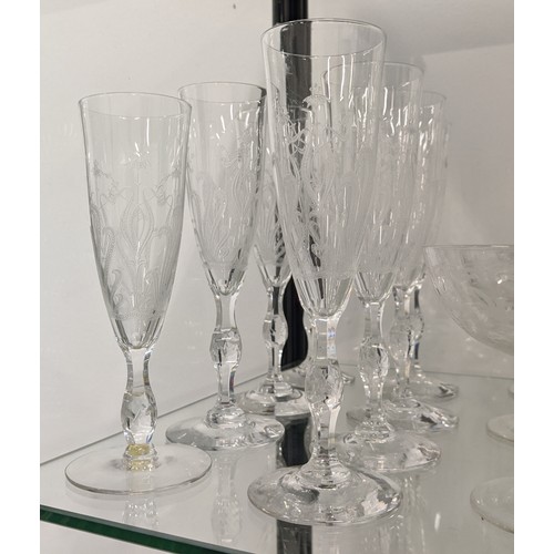 11 - QUANTITY OF ENGRAVED GLASSWARE, including eight champagne flutes, decanter vodka glass set, eight po... 