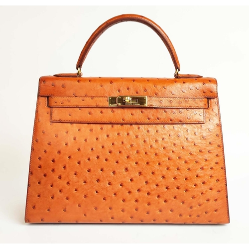 14 - HERMÈS KELLY SELLIER 32 OSTRICH, gold tone hardware, top handle, color matching leather lining, one ... 