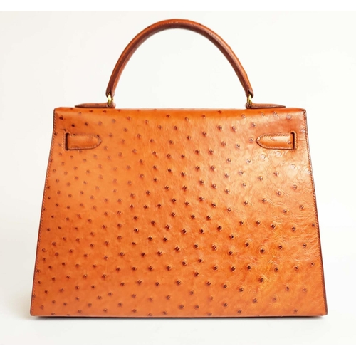 14 - HERMÈS KELLY SELLIER 32 OSTRICH, gold tone hardware, top handle, color matching leather lining, one ... 