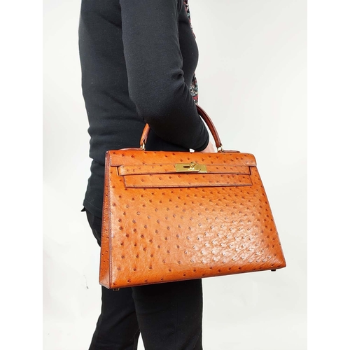 14 - HERMÈS KELLY SELLIER 32 OSTRICH, gold tone hardware, top handle, color matching leather lining, one ... 