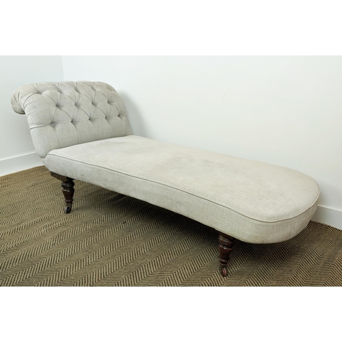 579 - DAYBED, Victorian walnut in buttoned taupe fabric on ceramic castors, 74cm H x 181cm L x 70cm D.