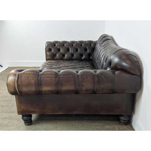 583 - SOFA, deep seated in buttoned brown leather, 74cm H x 205cm W x 107cm D.