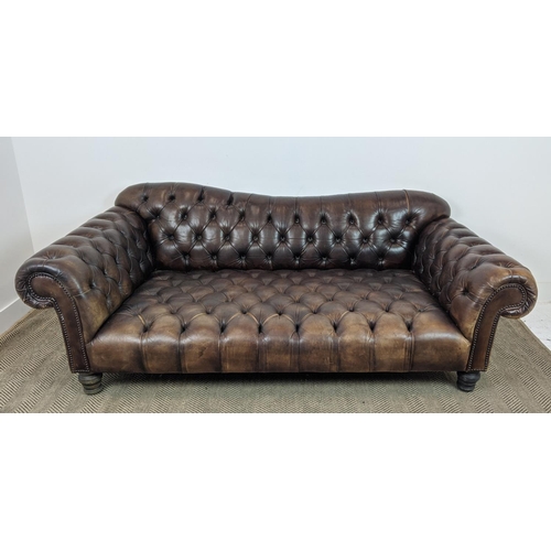 583 - SOFA, deep seated in buttoned brown leather, 74cm H x 205cm W x 107cm D.