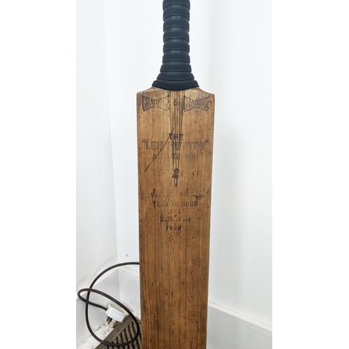 592 - CRICKET BAT AND BALL FLOOR LAMP, 122cm H x 35cm W x 20cm D.