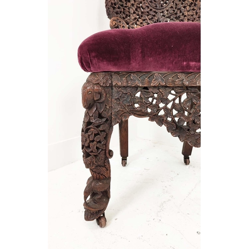 147 - BURMESE SIDE CHAIR, 19th century rosewood with a heavily carved back, with ram's head, 58cm W x 94cm... 