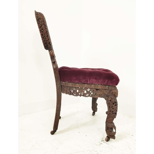 147 - BURMESE SIDE CHAIR, 19th century rosewood with a heavily carved back, with ram's head, 58cm W x 94cm... 