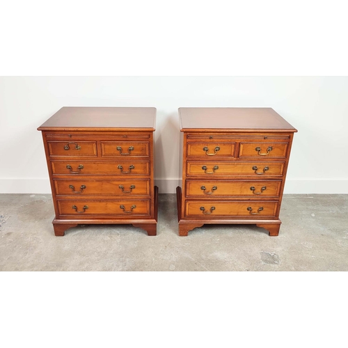 143 - BEDSIDE CHESTS, a pair, Georgian style yewwood, each with green leather slide above five drawers, 67... 