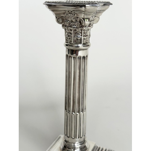 17 - SILVER CANDLESTICKS, a pair, 20th century Corinthian capped fluted columns, (old inscription), 21cm ... 