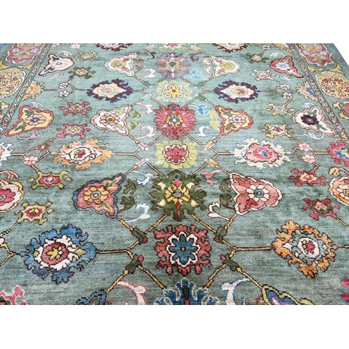 178 - FINE GREEN TURKISH OUSHAK CARPET, 390cm x 328cm.