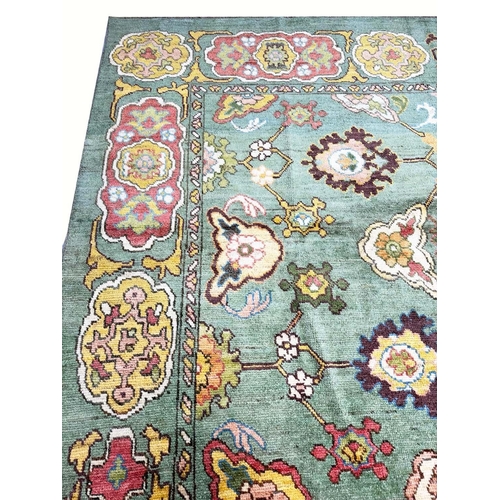 178 - FINE GREEN TURKISH OUSHAK CARPET, 390cm x 328cm.