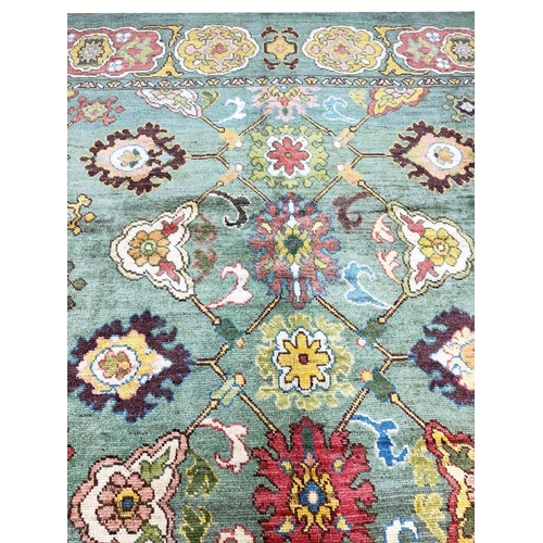 178 - FINE GREEN TURKISH OUSHAK CARPET, 390cm x 328cm.