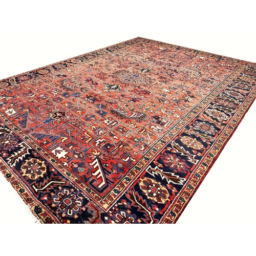 187 - ANTIQUE PERSIAN HERIZ CARPET, 355cm x 270cm.