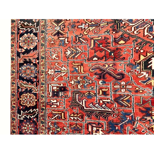 187 - ANTIQUE PERSIAN HERIZ CARPET, 355cm x 270cm.