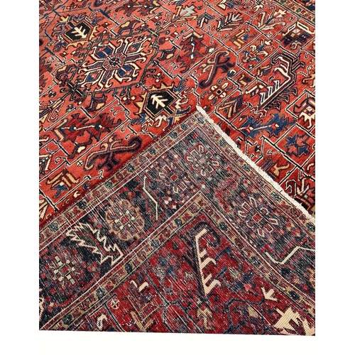 187 - ANTIQUE PERSIAN HERIZ CARPET, 355cm x 270cm.