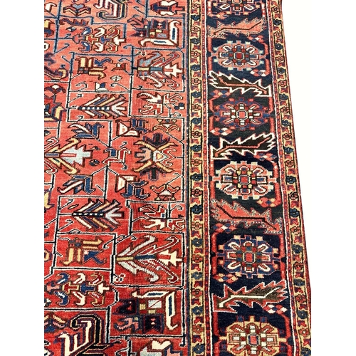 187 - ANTIQUE PERSIAN HERIZ CARPET, 355cm x 270cm.