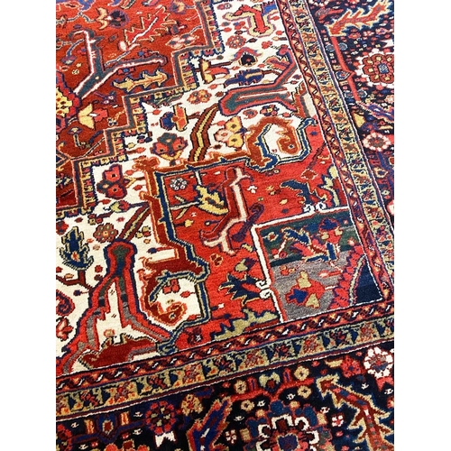 194 - ANTIQUE PERSIAN HERIZ CARPET, 375cm x 277cm.