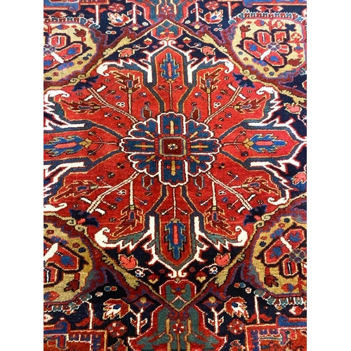 194 - ANTIQUE PERSIAN HERIZ CARPET, 375cm x 277cm.