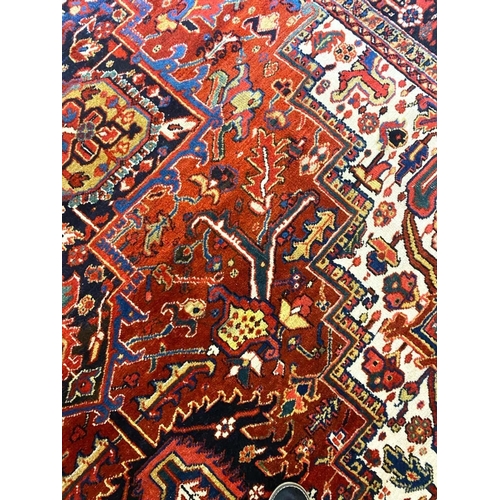 194 - ANTIQUE PERSIAN HERIZ CARPET, 375cm x 277cm.