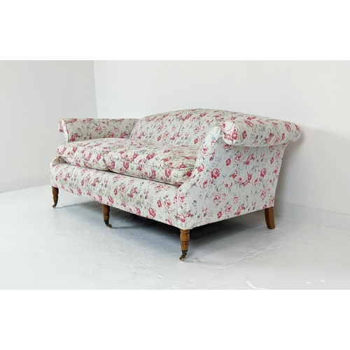 199 - SOFA, three seater, upholstered in Cath Kidson fabric with turned front supports and castors, 215cm ... 