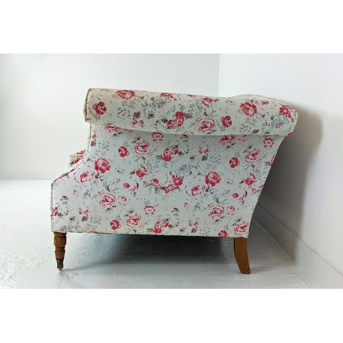 199 - SOFA, three seater, upholstered in Cath Kidson fabric with turned front supports and castors, 215cm ... 