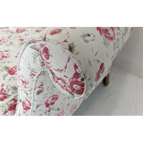 199 - SOFA, three seater, upholstered in Cath Kidson fabric with turned front supports and castors, 215cm ... 