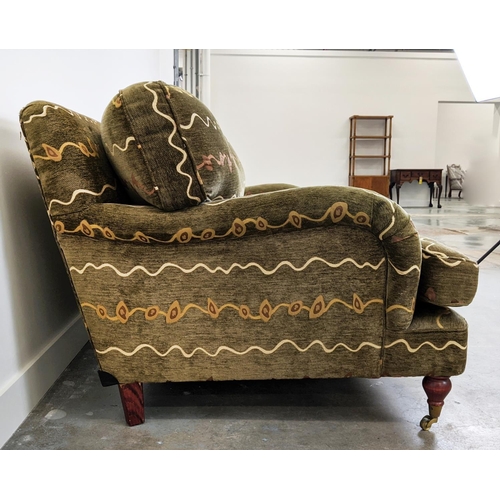 205 - HOWARD STYLE SOFA, two seater with geometric upholstery and turned front supports with brass castors... 