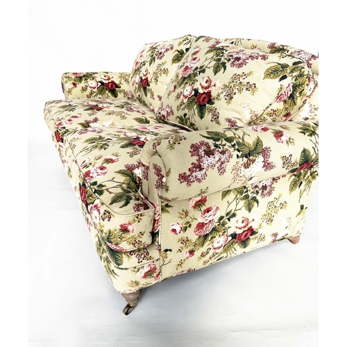 214 - SOFA BY HANCOCK AND MOORE, country house style rose print with arched back, scroll arms, turned supp... 