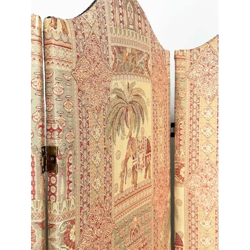 223 - SCREEN, three fold arched 'Raj' fabric, upholstered with elephants and palm trees and brass studded,... 