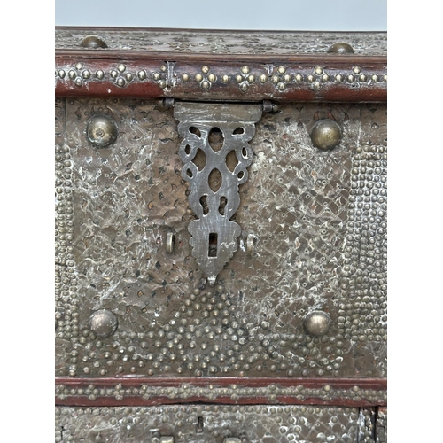 224 - ZANZIBAR CHEST, 19th century Moorish hardwood and allover brass studded with rising lid, candlebox a... 