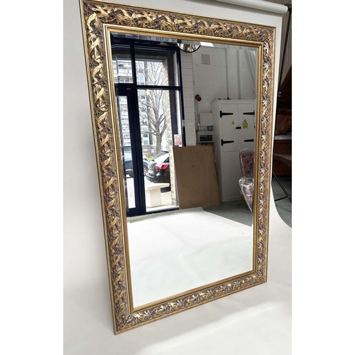 227 - WALL MIRROR, rectangular gilt composition with pierced foliate frame, 176cm H x 114cm.