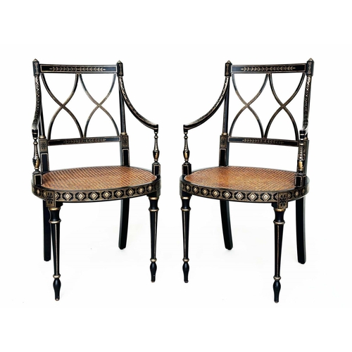 231 - ARMCHAIRS, a pair, Regency style black lacquered and gilt painted with lattice backs and cane seats,... 