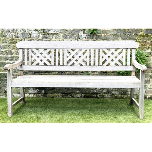 271 - GARDEN BENCH, well weathered silvery teak of slatted construction with lattice panelled back, 160cm ... 