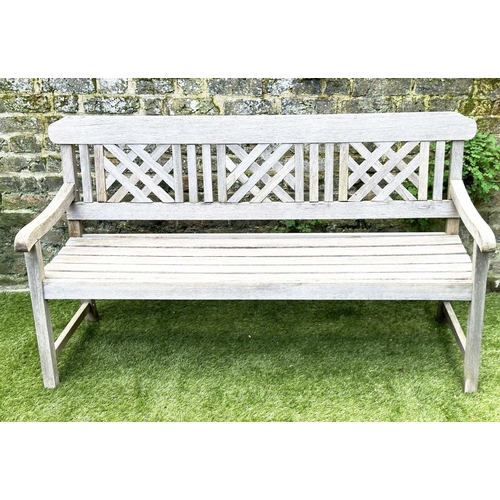 271 - GARDEN BENCH, well weathered silvery teak of slatted construction with lattice panelled back, 160cm ... 