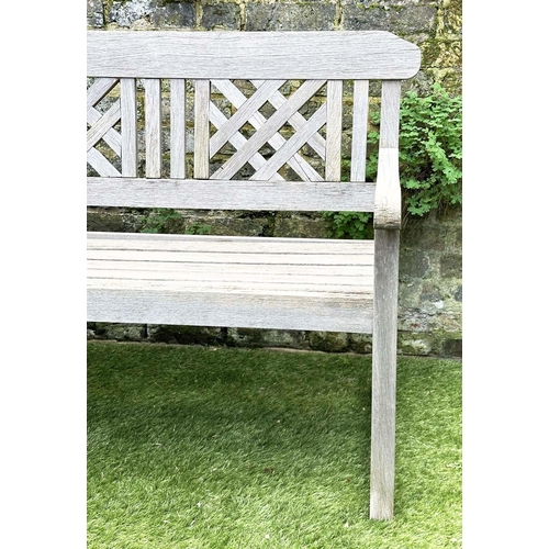 271 - GARDEN BENCH, well weathered silvery teak of slatted construction with lattice panelled back, 160cm ... 