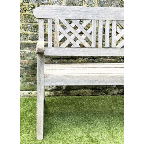 271 - GARDEN BENCH, well weathered silvery teak of slatted construction with lattice panelled back, 160cm ... 