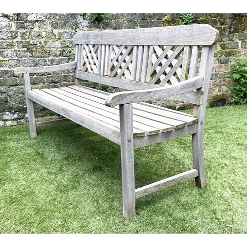 271 - GARDEN BENCH, well weathered silvery teak of slatted construction with lattice panelled back, 160cm ... 