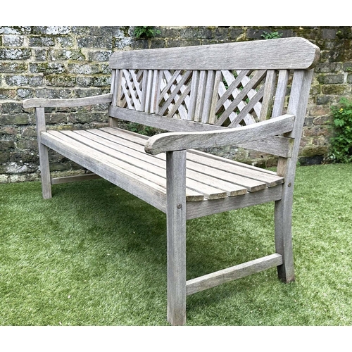 271 - GARDEN BENCH, well weathered silvery teak of slatted construction with lattice panelled back, 160cm ... 