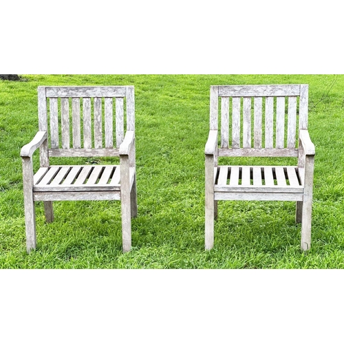 273 - GARDEN ARMCHAIRS, a pair, well weathered teak of slatted construction, 58cm W. (2)