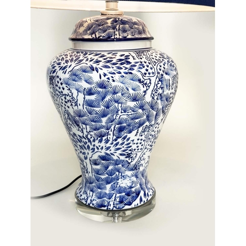 284 - TABLE LAMPS, a pair, Chinese fern blue and white ceramic of lidded vase form with lucite bases and s... 