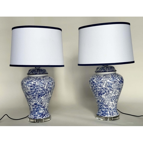 284 - TABLE LAMPS, a pair, Chinese fern blue and white ceramic of lidded vase form with lucite bases and s... 