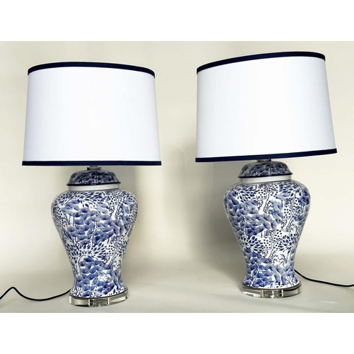 284 - TABLE LAMPS, a pair, Chinese fern blue and white ceramic of lidded vase form with lucite bases and s... 