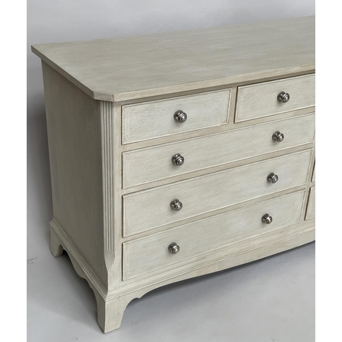 297 - LOW CHEST, Georgian style traditionally grey painted with nine drawers, canted angles and bracket su... 