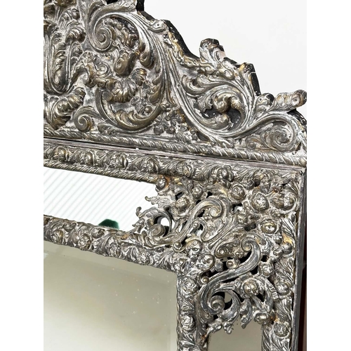 316 - DUTCH WALL MIRROR, 19th century Dutch repoussé silvered metal cushion frame, marginal plates and cre... 