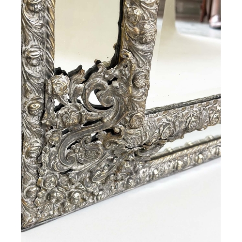 316 - DUTCH WALL MIRROR, 19th century Dutch repoussé silvered metal cushion frame, marginal plates and cre... 