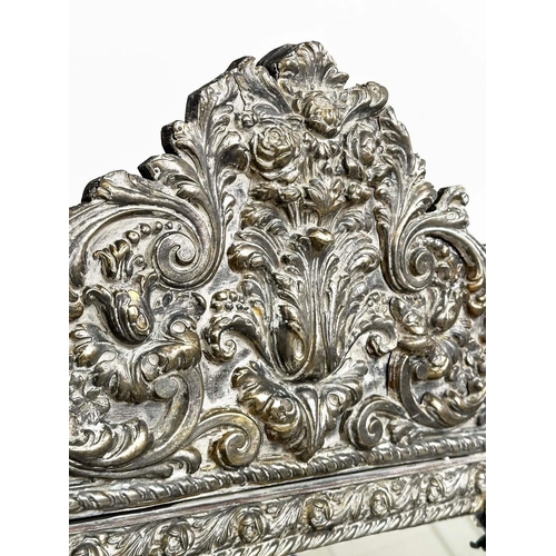 316 - DUTCH WALL MIRROR, 19th century Dutch repoussé silvered metal cushion frame, marginal plates and cre... 