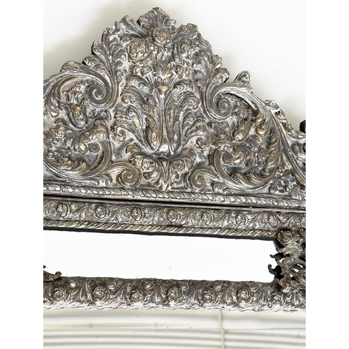 316 - DUTCH WALL MIRROR, 19th century Dutch repoussé silvered metal cushion frame, marginal plates and cre... 